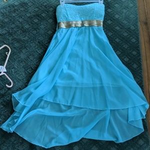 A blue and gold lace high-low dress